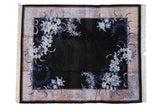 Chinese Art Deco rug with sprawling blue floral motifs on a lustrous charcoal field.
