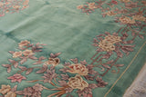 Mint green Art Deco rug showing embossed carving of rose, blush, mauve floral vinery and fringe.