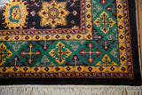 Vintage Agra rug corner detail with emerald green, saffron yellow border, ivory fringe.