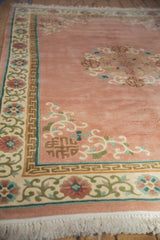 Vintage Japanese Peking carpet corner, rose field, scrolling floral border, and ivory fringe.