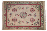 Vintage Japanese Peking carpet, ivory field, roundel medallion, pink, red, green floral design.