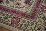 Japanese Peking carpet corner with full pile, intact selvage, and pink-green floral cloudband border.