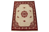 Vintage Indian Peking carpet with plush ivory field, cochineal red roundel medallion.