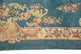 Indian Aubusson design detail: Sky blue field, pale gold scrolls, and blush rose ivory border.