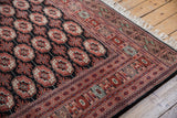 Intact original side cord selvage and detailed geometric border on a vintage Bokhara carpet.