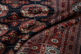 Plush pile texture and fine weave of a Vintage Bokhara carpet, detailing geometric gul medallions.