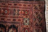 The original side cord selvage and tight geometric weave of a vintage Bokhara carpet.