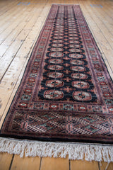 Plush antique ivory fringe and detailed geometric border of a vintage Bokhara runner.