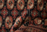 Plush pile texture of vintage Bokhara runner showing rust, ivory gul medallions and geometric border.