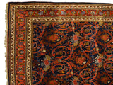 Corner of an antique Bijar carpet showing its intricate floral borders and original macrame.