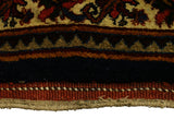 Close-up of the original side cord selvage and full pile of an antique Bijar carpet.