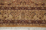 Vintage Kerman design carpet showing perched lovebirds, a floral border, and its clean ivory fringe.
