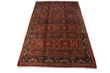 Vintage Mahal carpet with an allover floral blossom pattern in brick red, navy blue, and ivory.