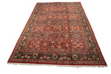 Vintage Persian Mahal carpet displayed at an angle, highlighting its grand scale and floral design.