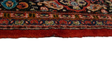Close-up of the vintage Mahal's intricate floral border and dense, full pile at the secured end.
