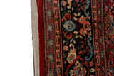 Original side cord selvage and plush pile of a vintage Mahal carpet with detailed floral borders.