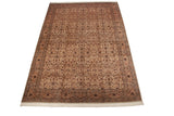 Perspective view of a large Pakistani Isfahan design carpet with a detailed allover floral pattern.