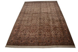 A full perspective view of a vintage Isfahan design carpet, highlighting its detailed floral pattern.