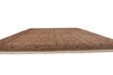 Low angle perspective down the entire length of a vintage Pakistani Isfahan design carpet.