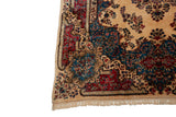 Corner of a vintage Kerman carpet with a contoured Rococo border in denim blue and red.
