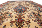 A low-angle view of the vintage Kerman carpet, showcasing its impressive length and plush, even pile.