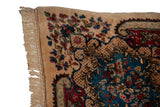 Like-new full pile and original side cord selvage on a hand-knotted vintage Persian Kerman carpet.