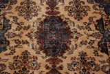 Plush, full wool pile of a vintage Kerman carpet showing detailed Rococo-style floral sprays.
