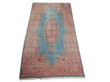 Vintage Kerman carpet: elongated floral medallion, powder blue field, intricate thousand flower border.