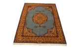 A vintage Romanian Tabriz carpet from an angle, showcasing the full design and thick pile.