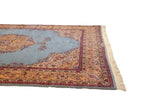 Intact side cord selvage, clean fringe, and floral border on a vintage Romanian carpet.