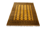Daulatabad carpet's saffron yellow field with charcoal elephant's footprint gul motifs and patterned borders.