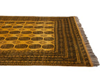 Saffron yellow Daulatabad rug corner with charcoal gul motifs and original intact fringe.