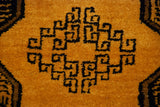 Intricate charcoal elephant's footprint gul motif on saffron yellow Daulatabad rug pile.