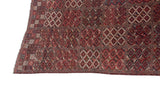 A collector's antique Beshir carpet with a geometric multi-panel design of diamond medallions in inverted colors.