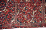 Intricate geometric borders and original side cord selvage on a fine antique Beshir carpet.