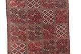Inverted coloration within the multi-panel diamond medallions of a collector Beshir carpet.