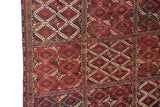 The original side cord selvage and multi-panel diamond design of an antique Beshir carpet.