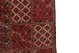 Detail of the geometric multi-panel design and inverted coloration on a fine antique Beshir carpet.