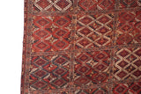 Intact original side cord selvage and dense pile of a geometric antique Beshir carpet.
