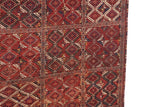 Intact original side cord selvage along the geometric diamond medallions of an antique Beshir carpet.
