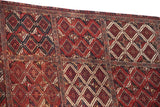 Inverted coloration within the multi-panel diamond medallions of a collector Beshir rug.