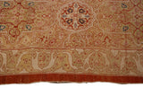 Fine hand-knotted pile and floral border at the secured end of an antique Tabriz carpet.