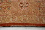 The finely woven back and intact original red selvage of an antique Persian Tabriz carpet.