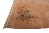 Plush dusty rose pile and fringe with Art Deco style floral motifs.