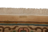 Close-up showing the secured cream fringe and plush pile of a vintage Japanese carpet.
