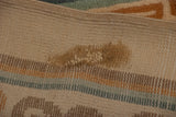 Reverse view of the hand-knotted carpet showing the foundation and a detailed expert mend.