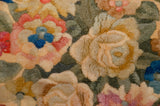 Original full pile height of the Japanese Savonnerie carpet, featuring rose bouquets in peach, blue, and sage.