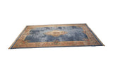 Scrolling vinery and rose bouquets on the European Savonnerie rug border with fringe.