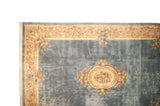 Savonnerie rug's central cameo medallion featuring dense rose bouquets and blue field.