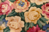 Blooming rose bouquets and foliage in cochineal red, pink, beige, and green tones.